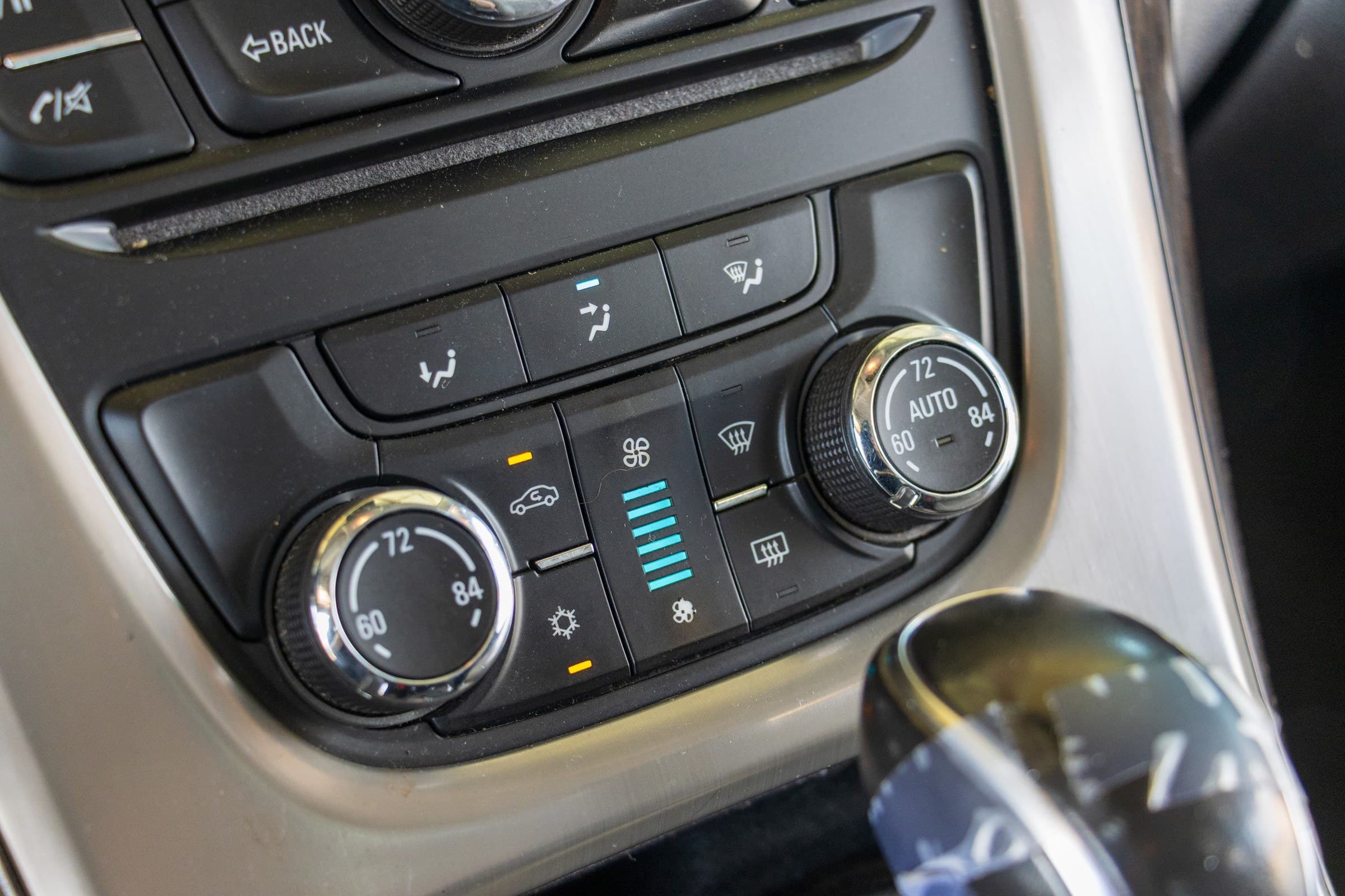 Close-up of the Verano's dual-zone automatic climate controls, with heated-seat and heated-steering-wheel buttons above.